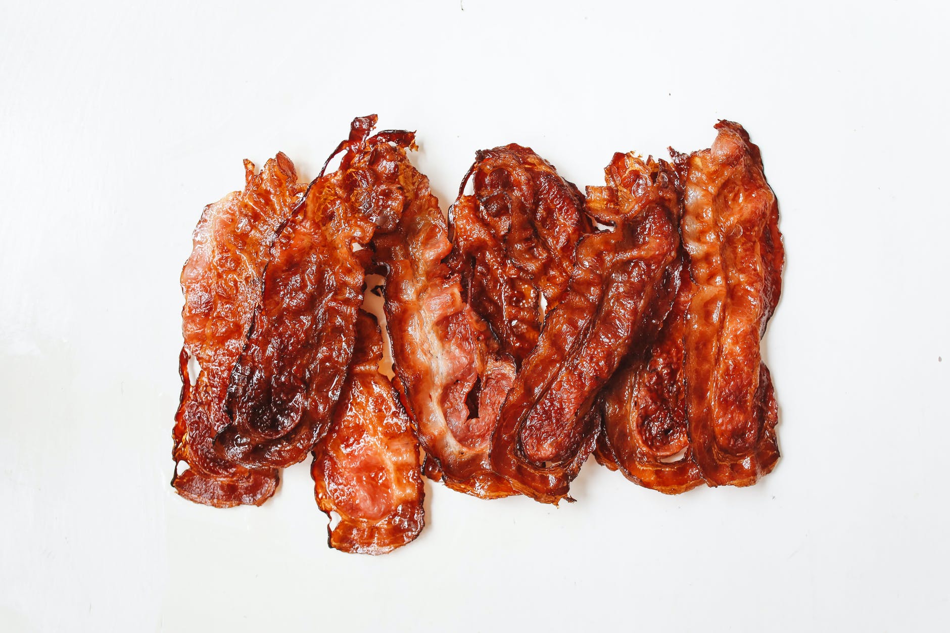 fried strips of meat on white surface